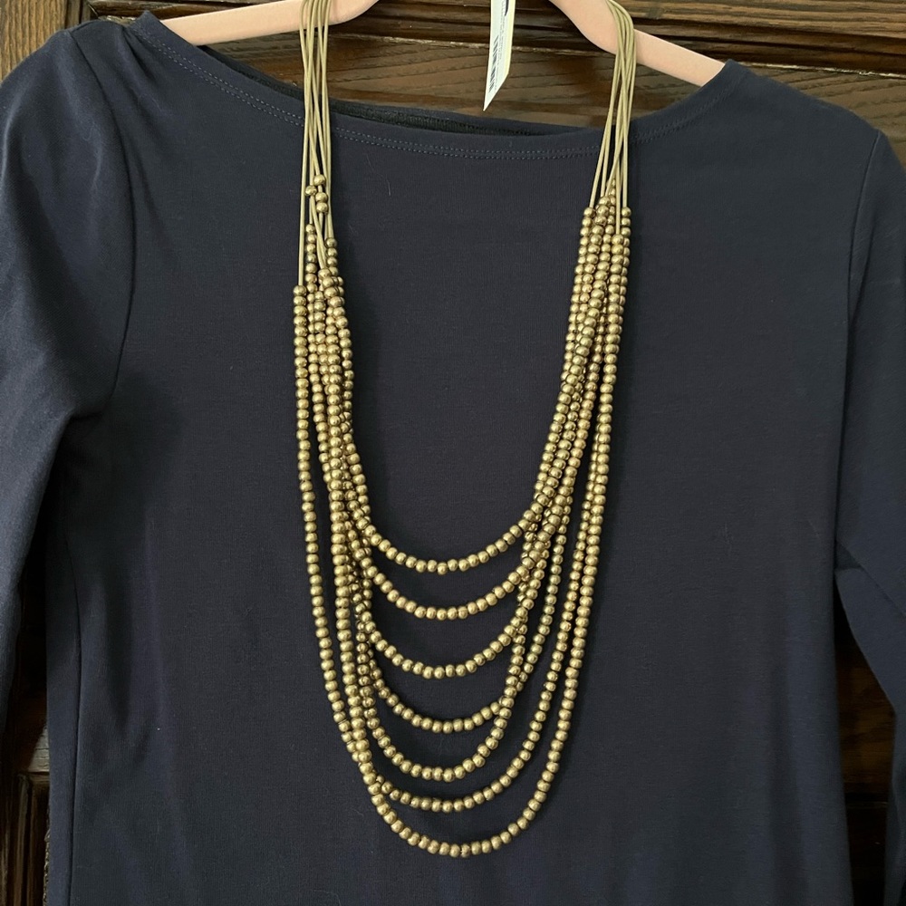 Statement necklace - gold beads.- will dress up any outfit - nwt